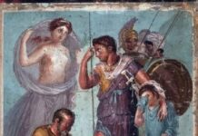 Ndërhyrjet mjekësore përgjatë antikitetit: Skena tregon mjekun/shëruesin Japix duke hequr me kujdes majën e shigjetës nga këmba e heroit dardan të Trojës, Enea!